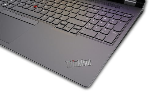 Black Lenovo ThinkPad laptop corner showing keyboard with numeric keypad and red TrackPoint on touchpad.