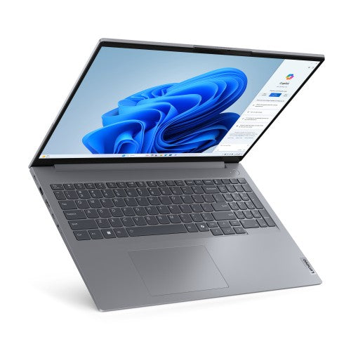 Grey Lenovo ThinkBook 16 G7 laptop with 16-inch screen, backlit keyboard, and Windows 11 Pro display showing blue swirl.