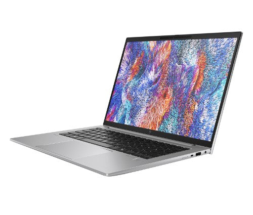 HP ZBook Firefly G11 slim grey laptop with colorful abstract screen and black keyboard angled view.