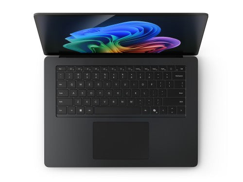Black Microsoft Surface Laptop 7 with 15-inch touchscreen displaying colorful abstract wallpaper, full keyboard, and large.