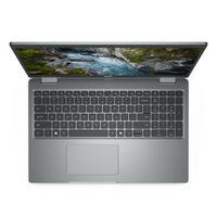 Gray Dell Precision 3591 laptop with full-sized keyboard and 15.6-inch display showing nature wallpaper.