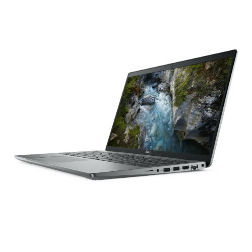 Slim grey Dell Precision 3591 laptop with 15.6-inch Full HD display showing a waterfall scene, angled view showing keyboard.