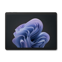 Black Microsoft Surface Pro 10 tablet with thin bezels displaying abstract purple and blue wallpaper on screen.