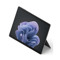 Black Microsoft Surface Pro 10 tablet with kickstand, 13-inch screen displaying abstract purple swirl wallpaper.
