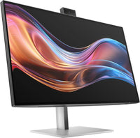 27-inch HP 4K monitor with slim bezels and built-in pop-up webcam on silver stand.