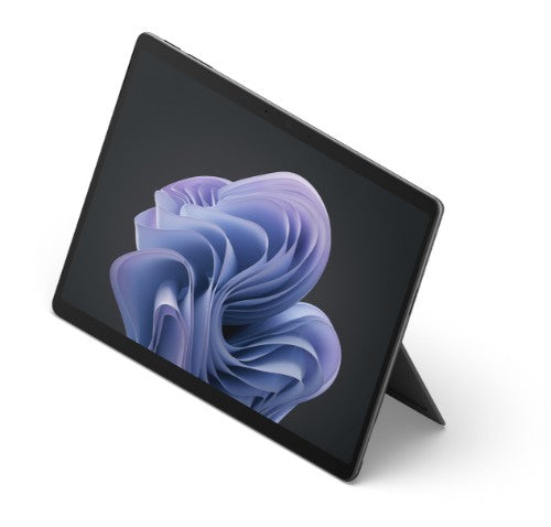 Black Microsoft Surface Pro 10 tablet with kickstand and abstract purple wallpaper on screen.