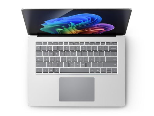 Silver Microsoft Surface Laptop 7 open showing keyboard and vibrant screen display.