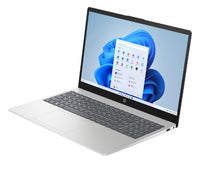 Silver HP laptop with 15.6-inch Full HD display, black keyboard, and Windows 11 Home screen.